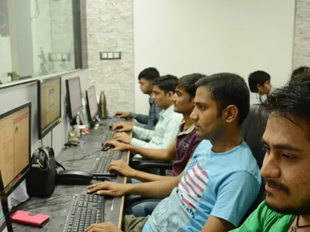 Developers working at their desks in the Keshav Infotech studio